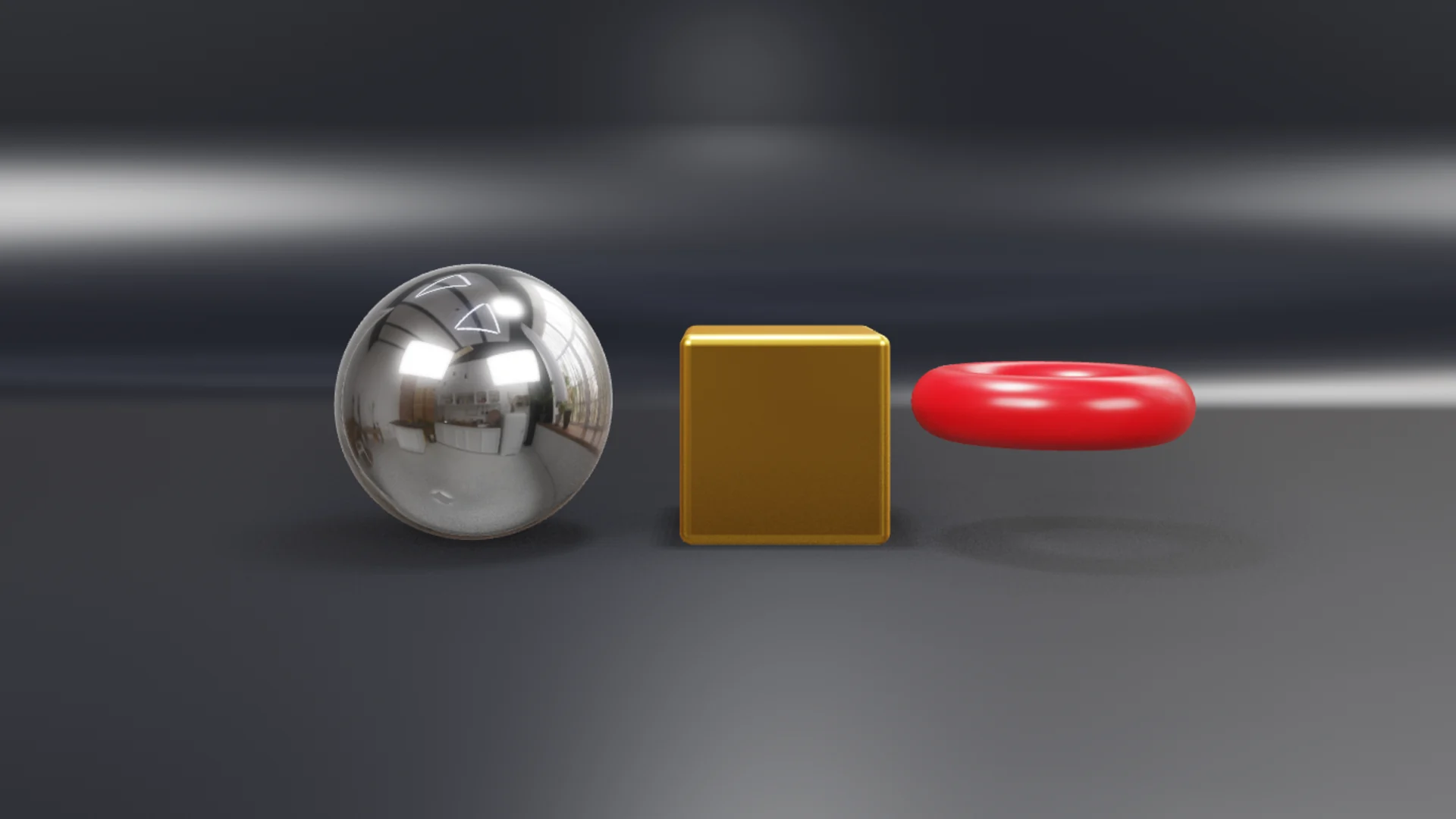 A chrome ball, a gold box and a red ring on a studio set, lit in real time