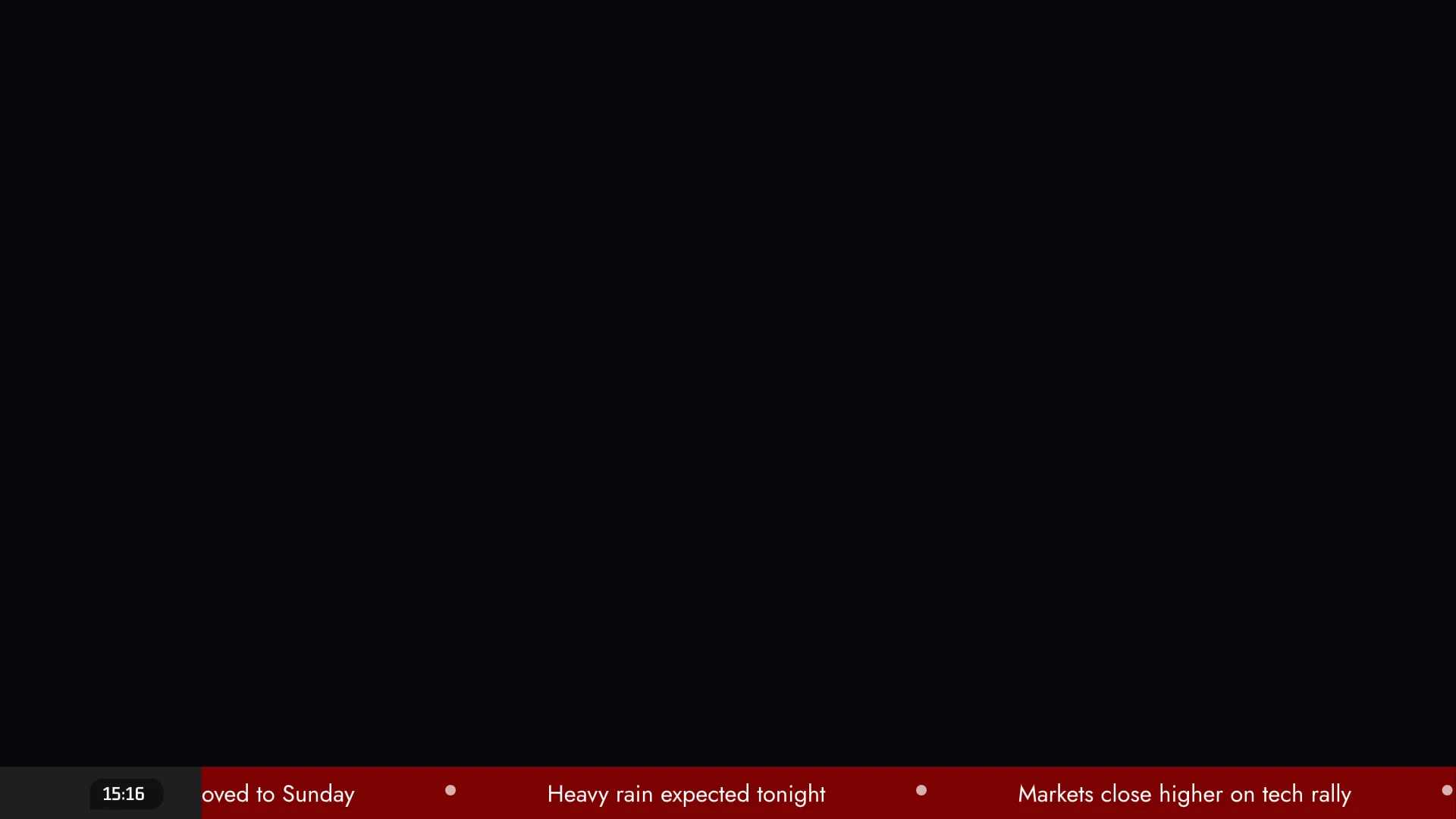 The scrolling ticker along the bottom of the screen: a clock, then headlines moving left