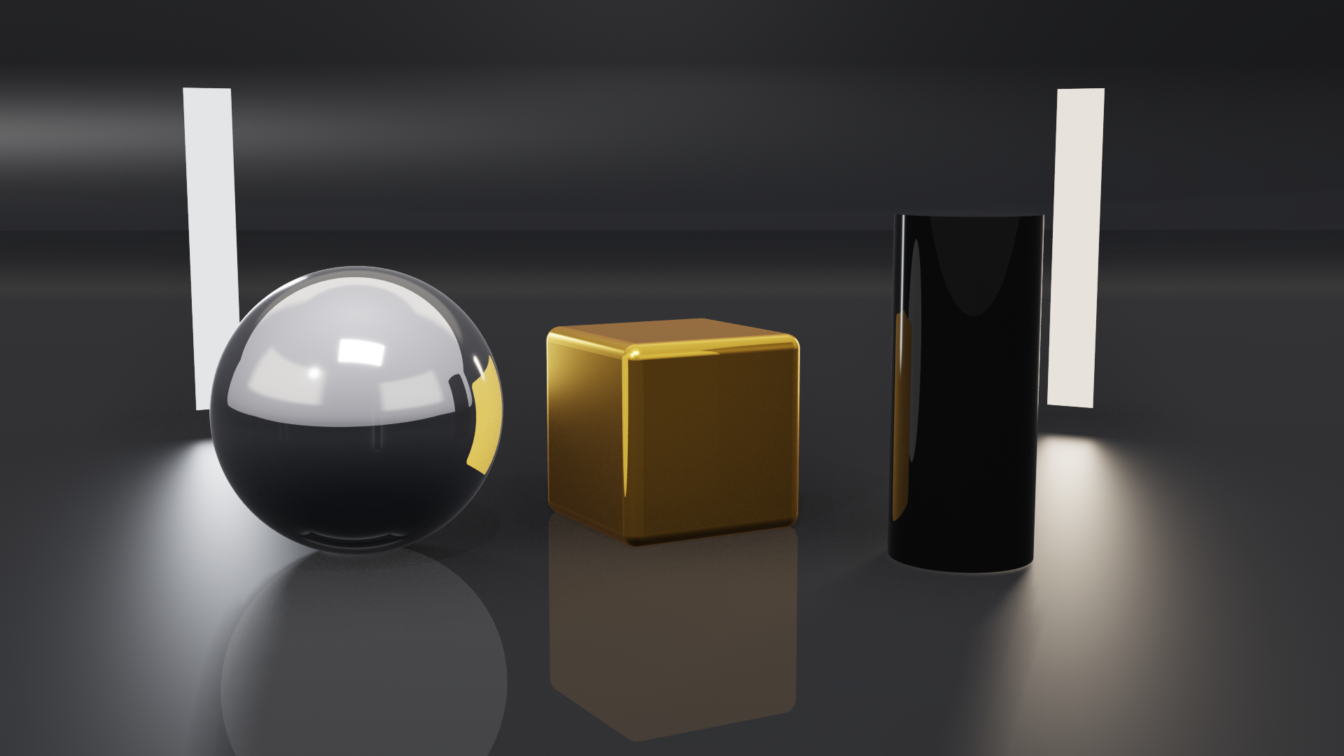 Two strip softboxes behind a chrome ball, a gold box and a black lacquer cylinder, seen in the shot, their light soft on the polished floor; a third lights the set from above, out of frame
